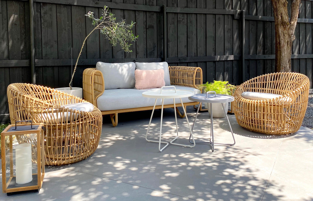 Cosy outdoor lounge area with comfortable weave outdoor furniture