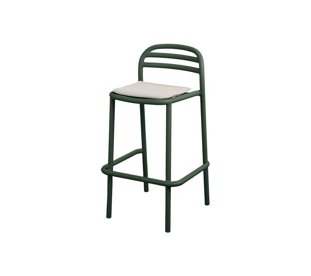 Tabouret de bar vert foncé avec un coussin en sable.