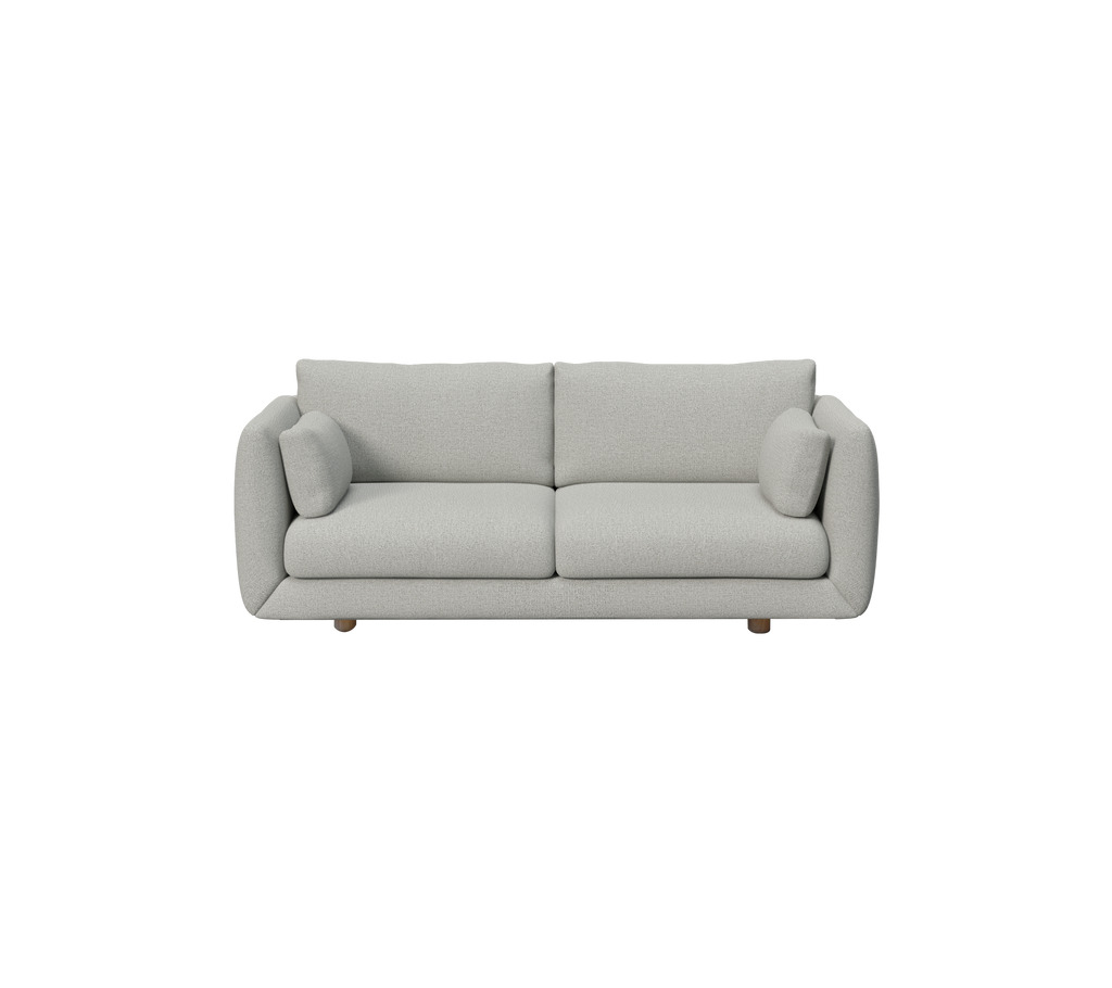 Canapé moderne gris clair avec des coussins ronds dans un design minimaliste.