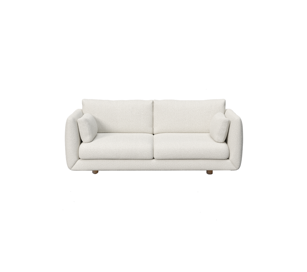 Canapé moderne blanc avec deux coussins.