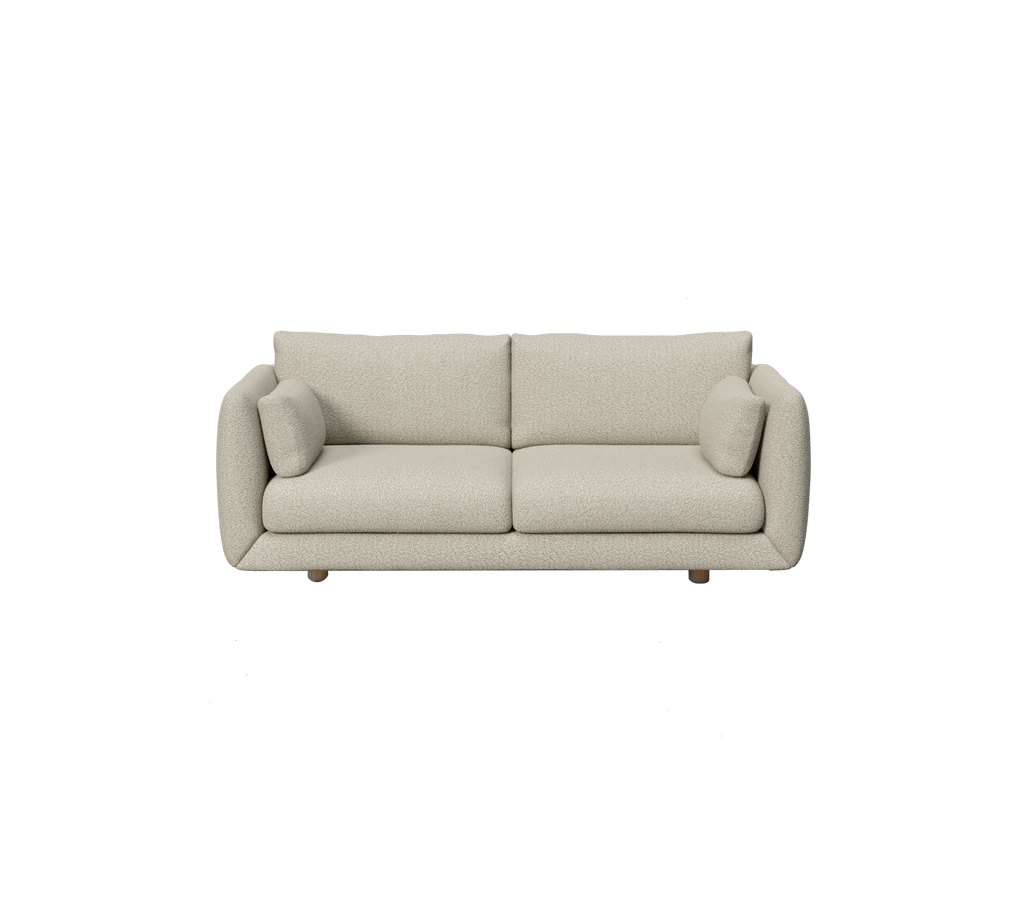 Canapé moderne marron clair avec des coussins ronds dans un style minimaliste.
