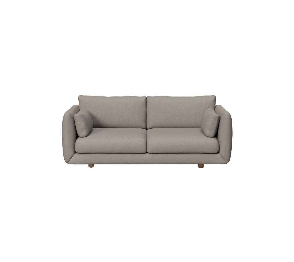 Canapé moderne marron clair avec des coussins ronds dans un cadre de salon.