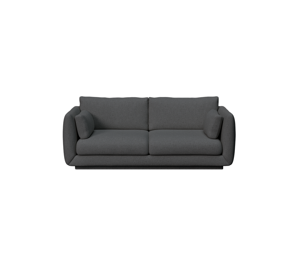 Canapé moderne vert foncé avec des coussins.