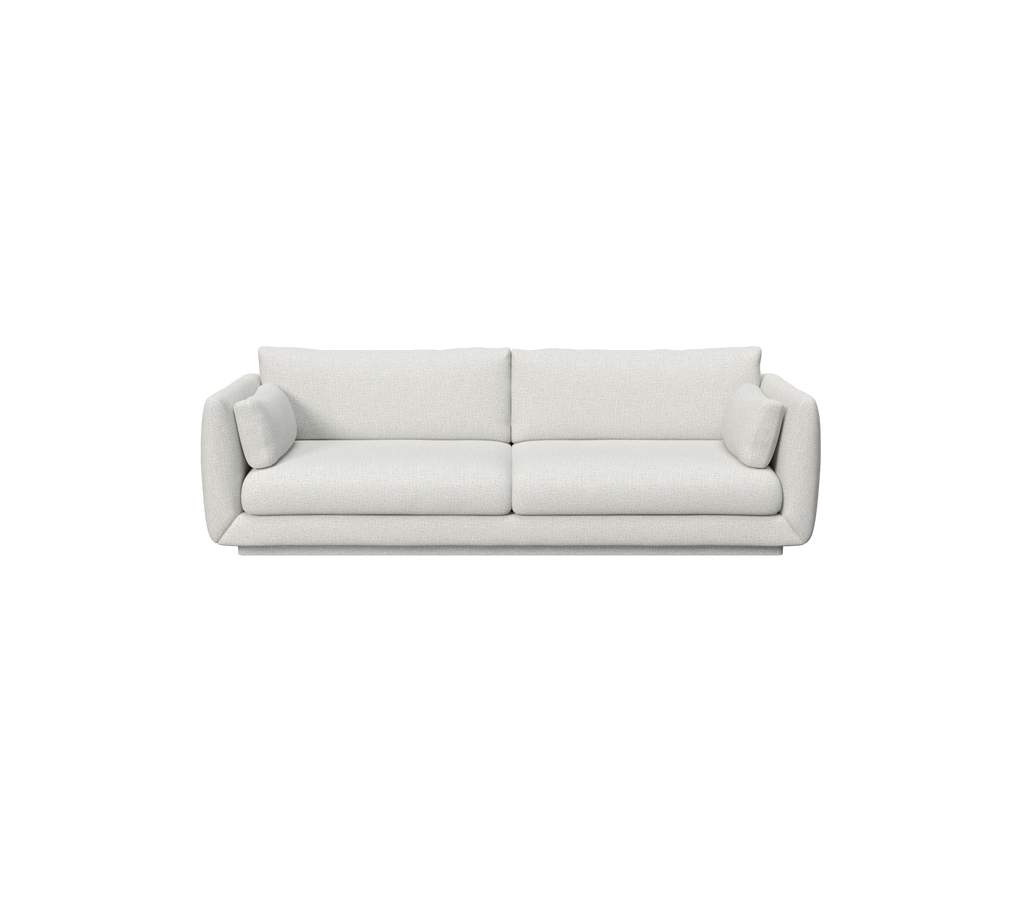 Canapé gris clair avec deux coussins ronds dans un design moderne.