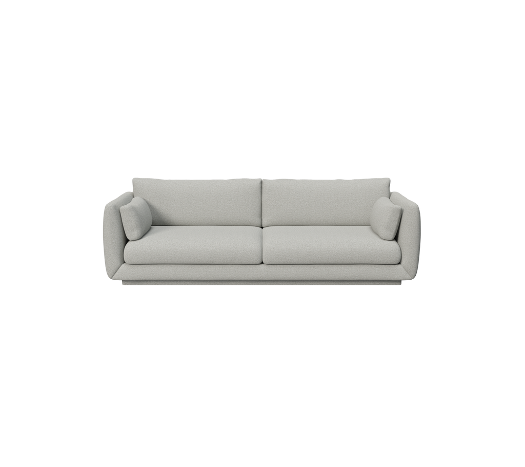 Canapé moderne gris clair avec des coussins ronds.