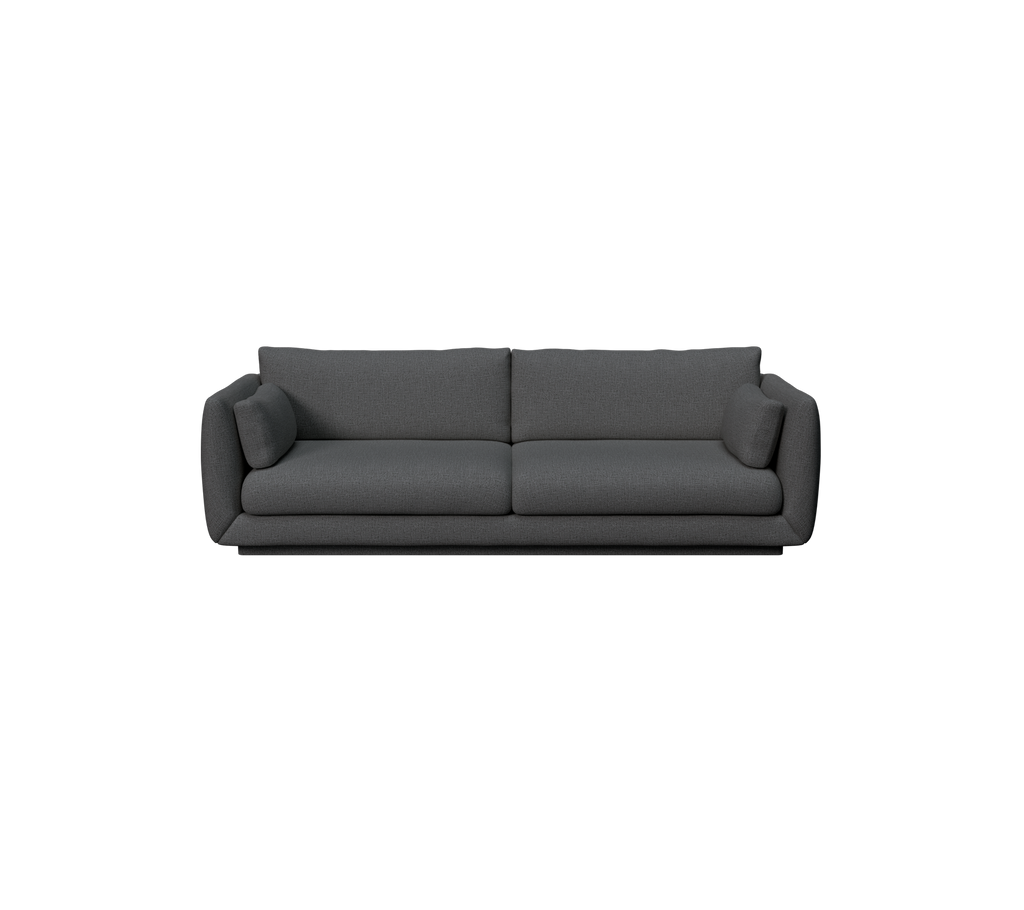 Canapé moderne vert foncé avec un design épuré et des coussins confortables.