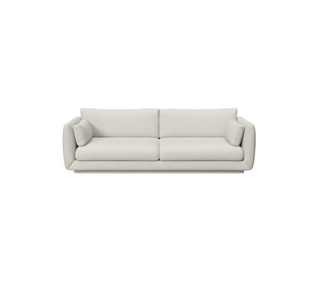 Canapé moderne couleur sable avec des coussins doux et un design minimaliste.