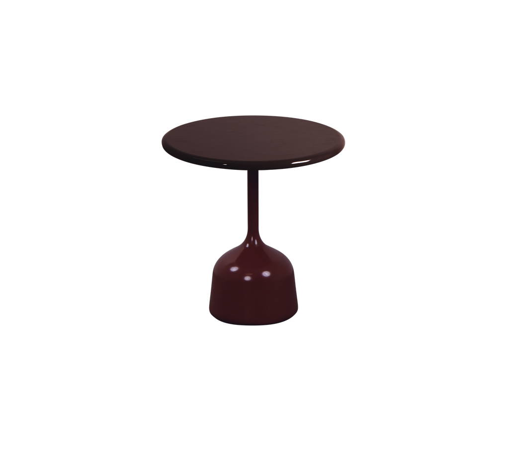 Table bourgogne avec un dessus rond et une base arrondie dans un design moderne.