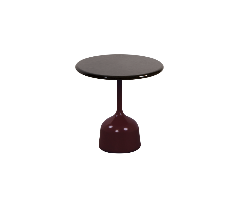 Table ronde bordeaux et noire avec un design de base unique.