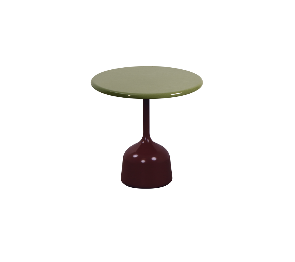 Table verte avec une base bordeaux dans un design moderne.