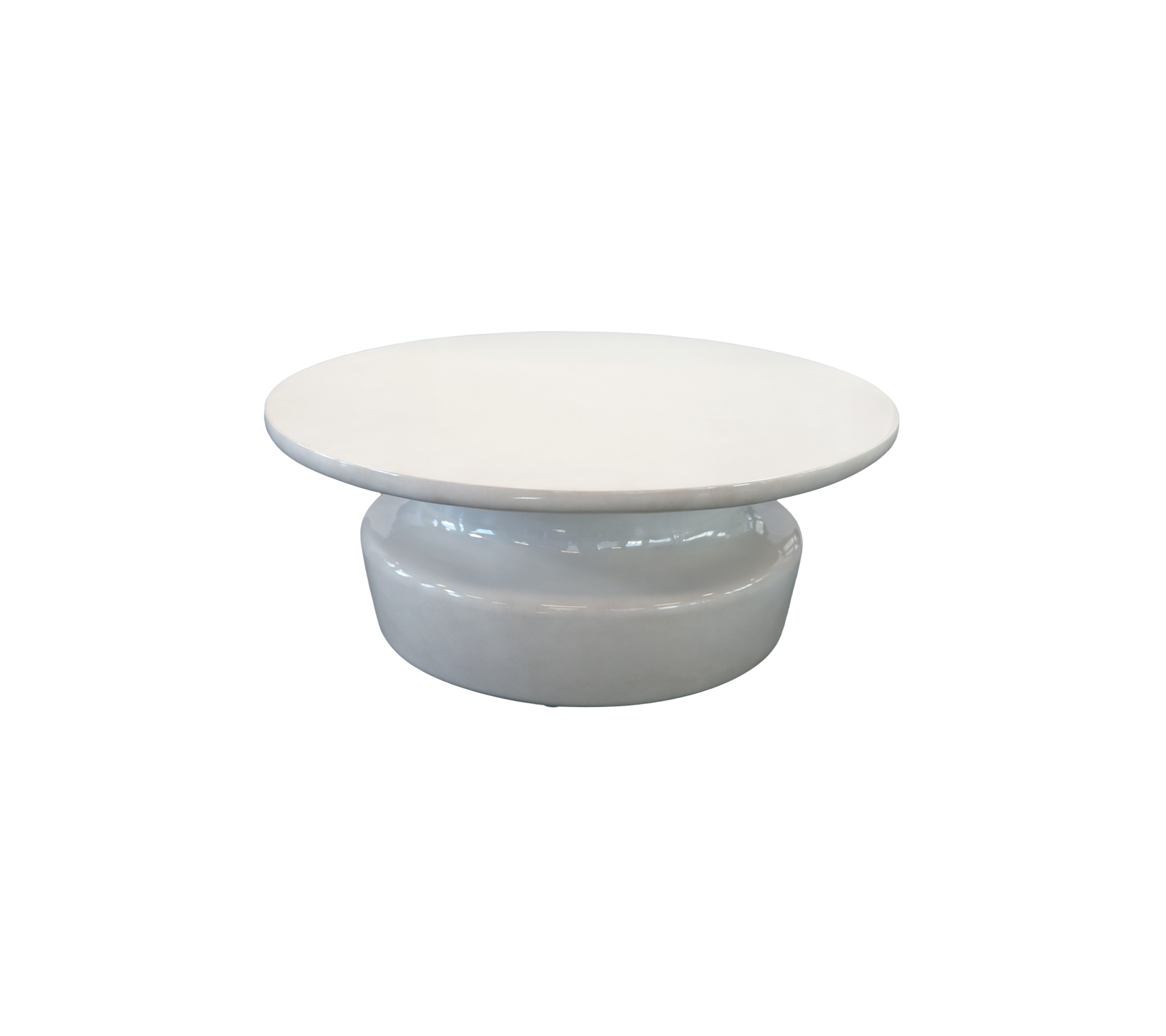 Table basse blanche moderne avec un plateau rond et une base incurvée.