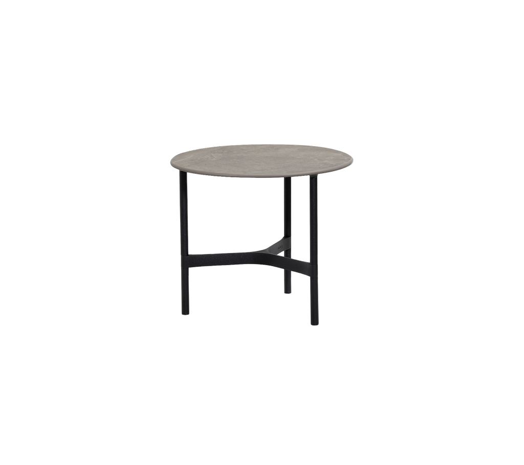 Table ronde grise avec une base noire.