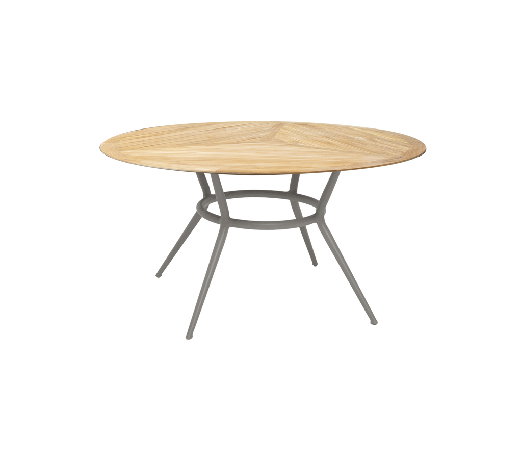 Table ronde taupe au design simple et aux pieds élégants.