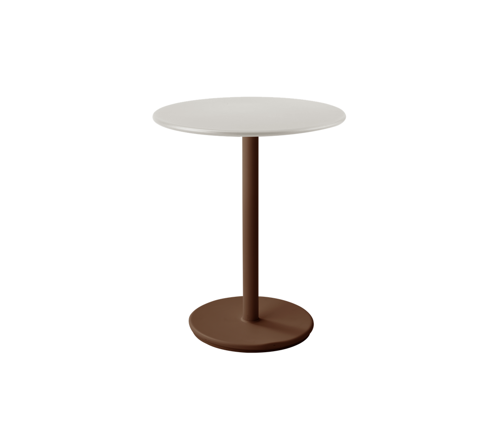 Table blanche moderne avec une base rouge désert dans un cadre lounge élégant.