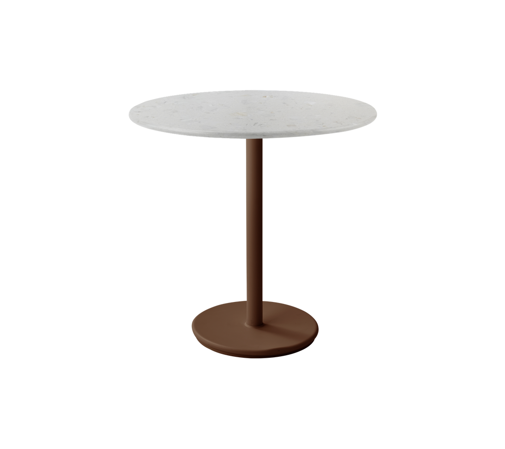 Table ronde moderne avec un dessus blanc et une base rouge désert.