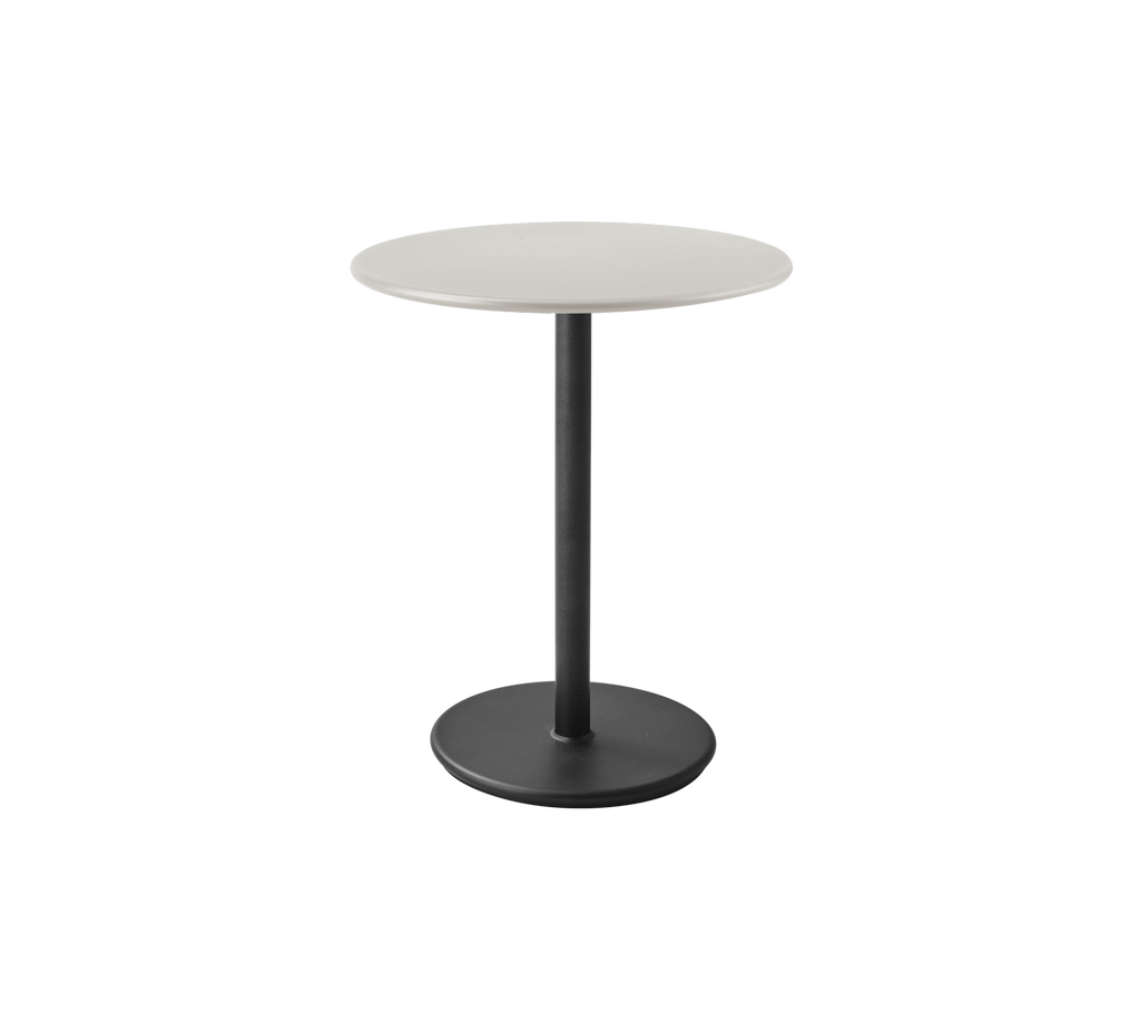 Table grise moderne avec un plateau rond et une base noire.