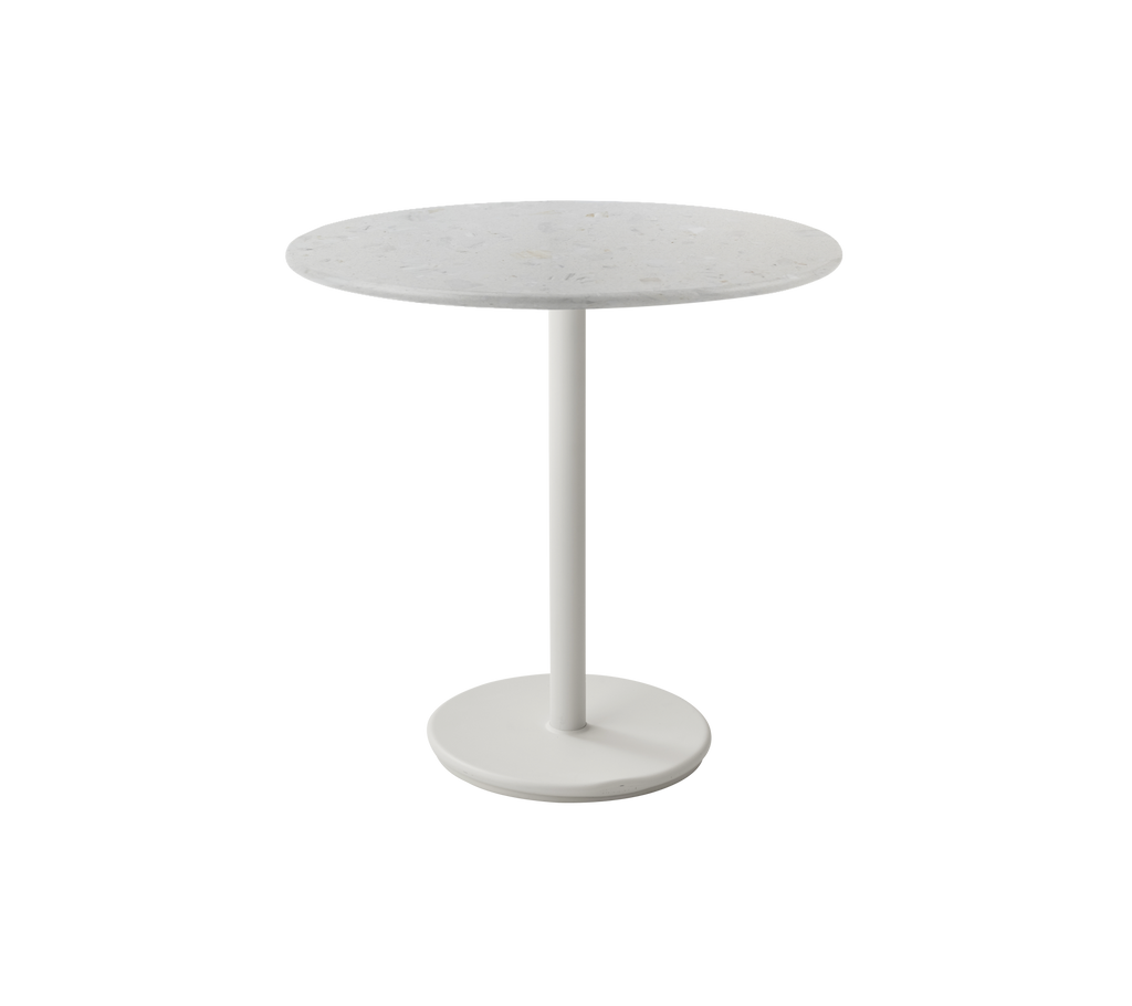 Table ronde blanche moderne au design minimaliste.