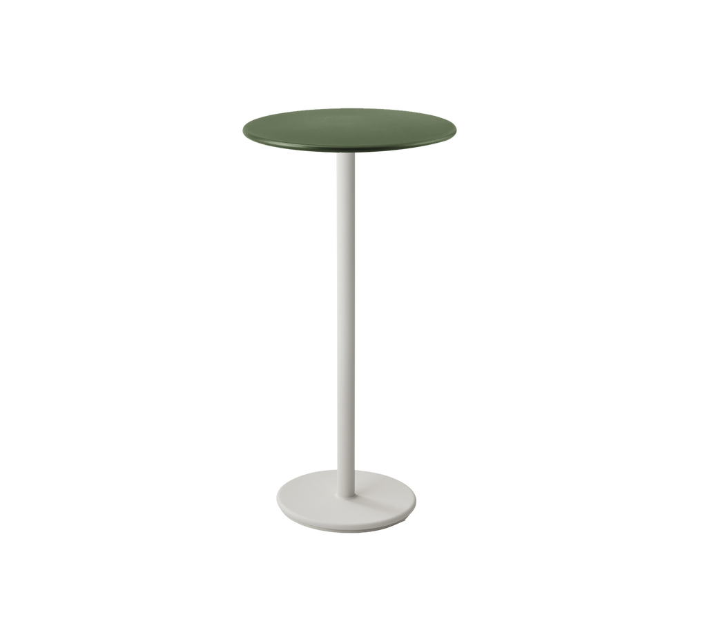 Table moderne vert foncé avec une base blanche dans un design épuré.