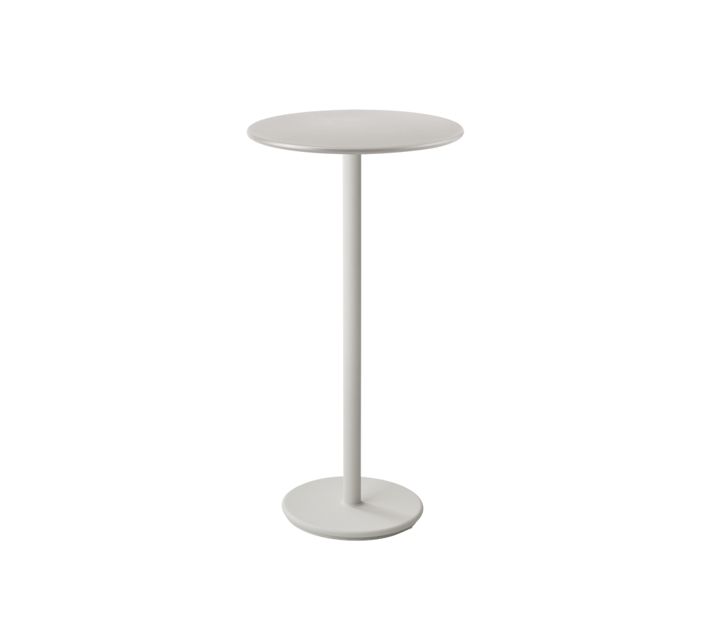 Table moderne couleur sable avec un design minimaliste.