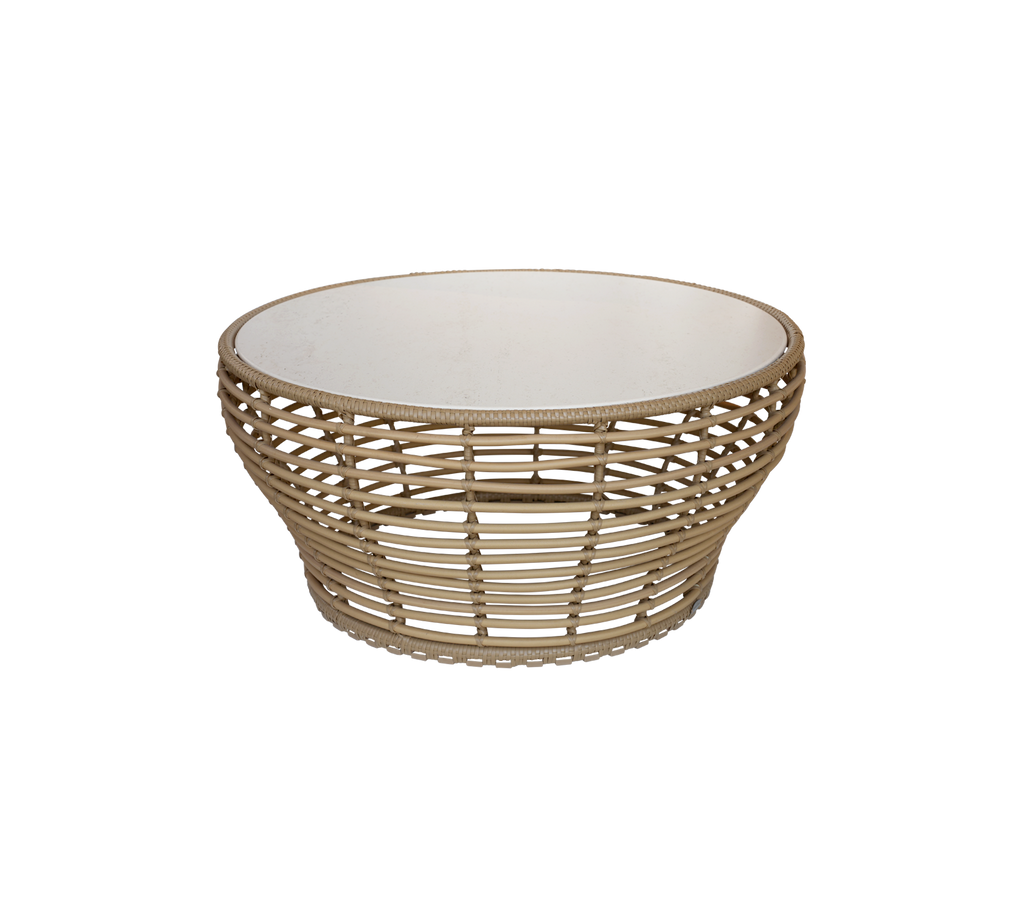 Panier ronde élégante avec un design tissé naturel et un intérieur blanc, parfaite pour ranger des objets ou comme pièce décorative.