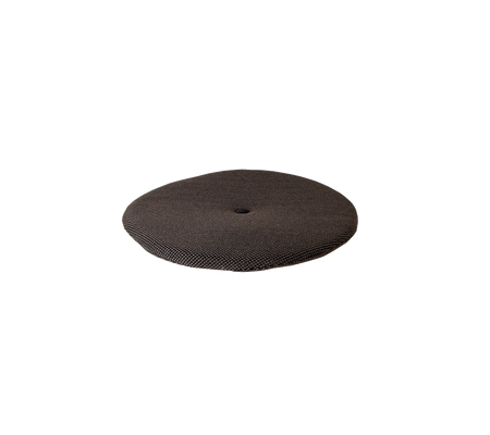 Coussin rond et texturé de couleur sombre, conçu pour le confort et le soutien. Idéal pour ajouter des places assises ou de la décoration.