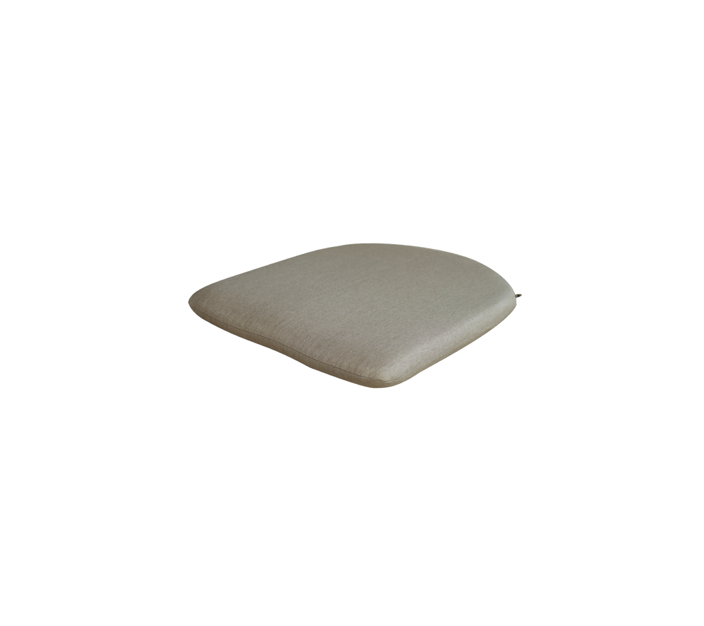 Coussin taupe avec une surface lisse.