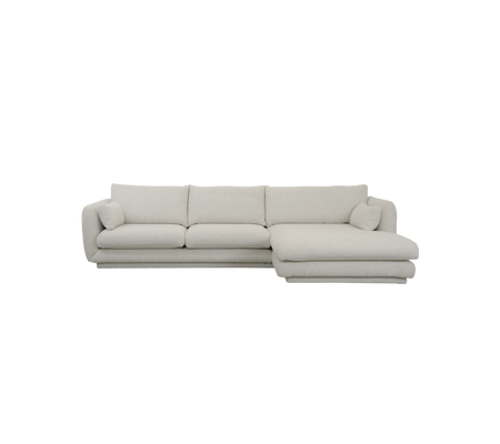 Sofa moderne couleur sable avec des lignes épurées et des coussins doux.