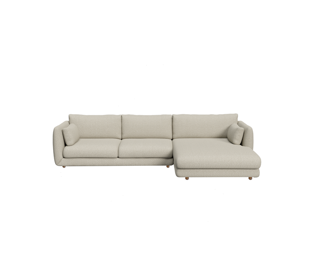 Canapé sectionnel marron clair au design contemporain et aux coussins moelleux.