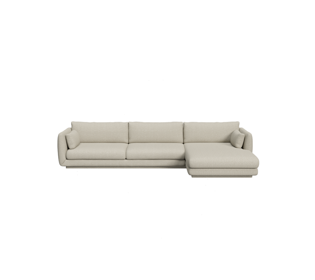 Canapé sectionnel beige clair dans un cadre de lounge moderne.