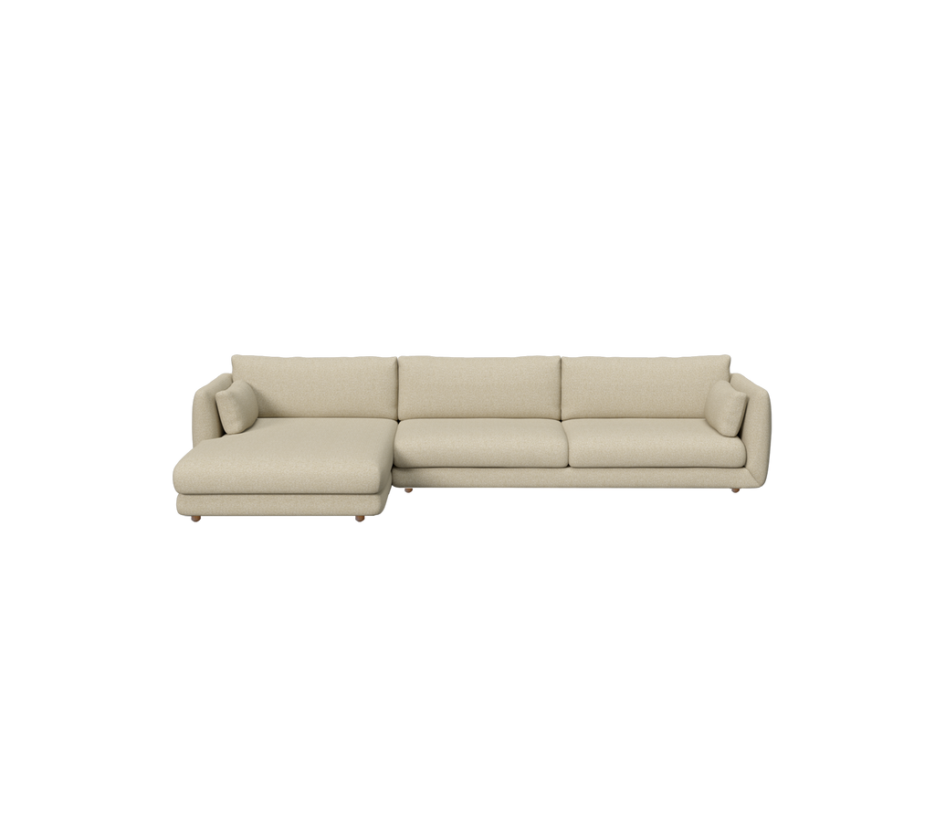Canapé moderne brun clair avec une section chaise longue dans un cadre lounge.