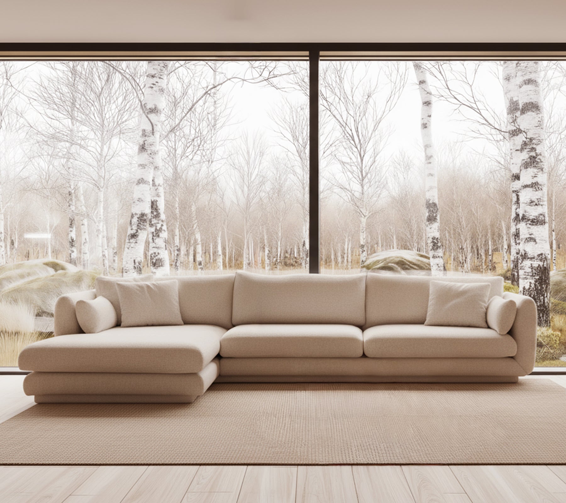 Canapé moderne beige dans un environnement de salon lumineux avec de grandes fenêtres.