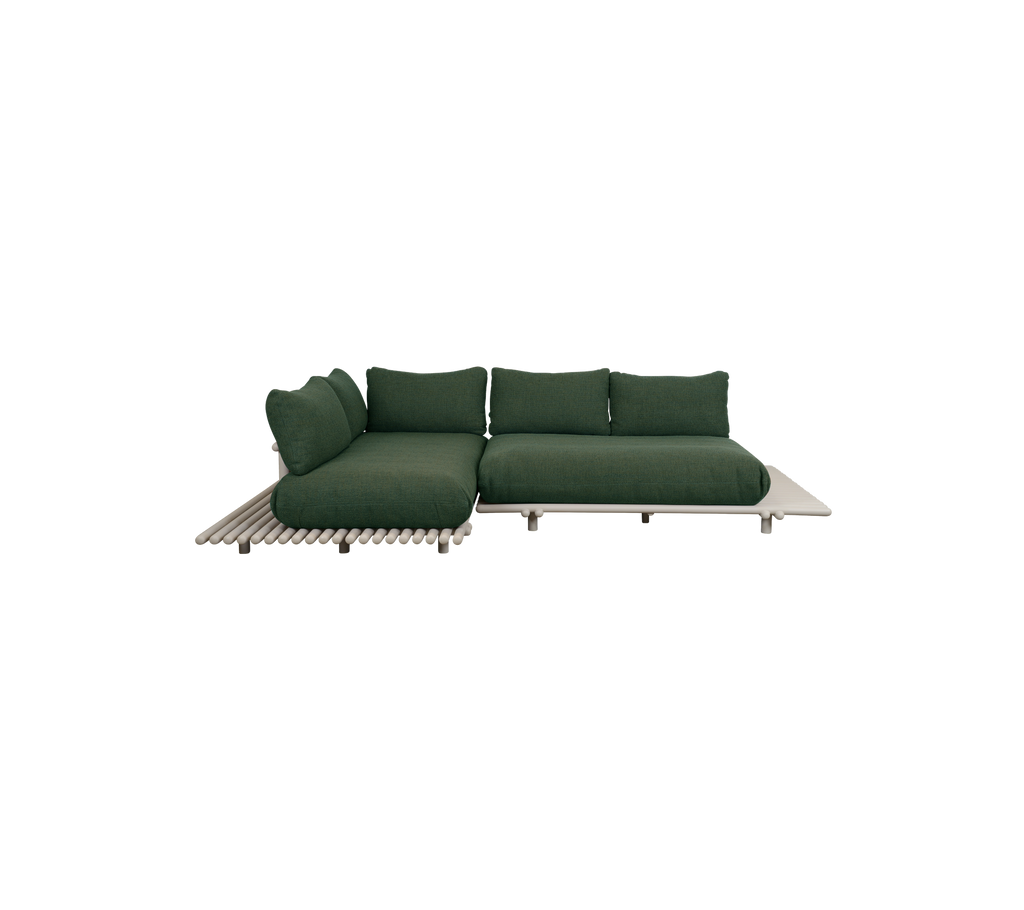 Canapé moderne vert foncé avec un design minimaliste.