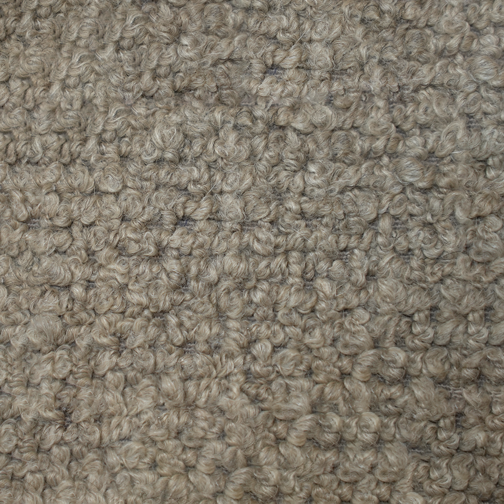Tissu beige texturé en gros plan.
